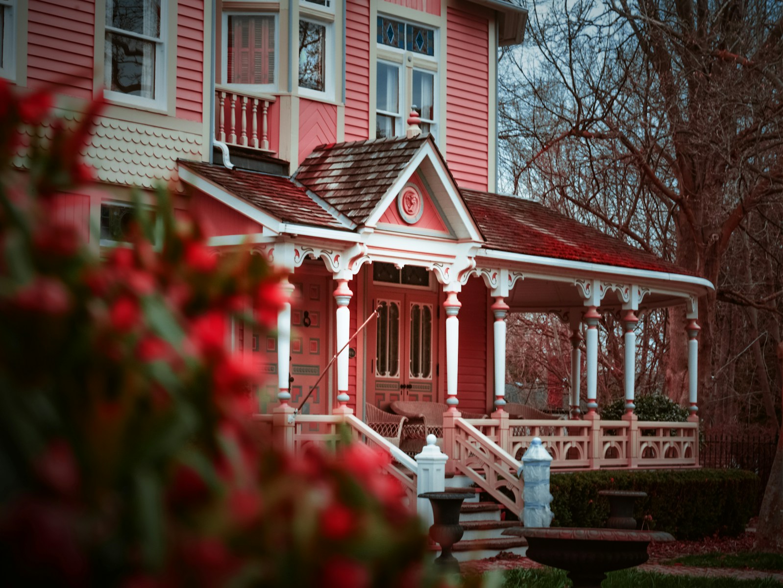 selective focus photography of red and white wooden house during daytime homeowners insurance