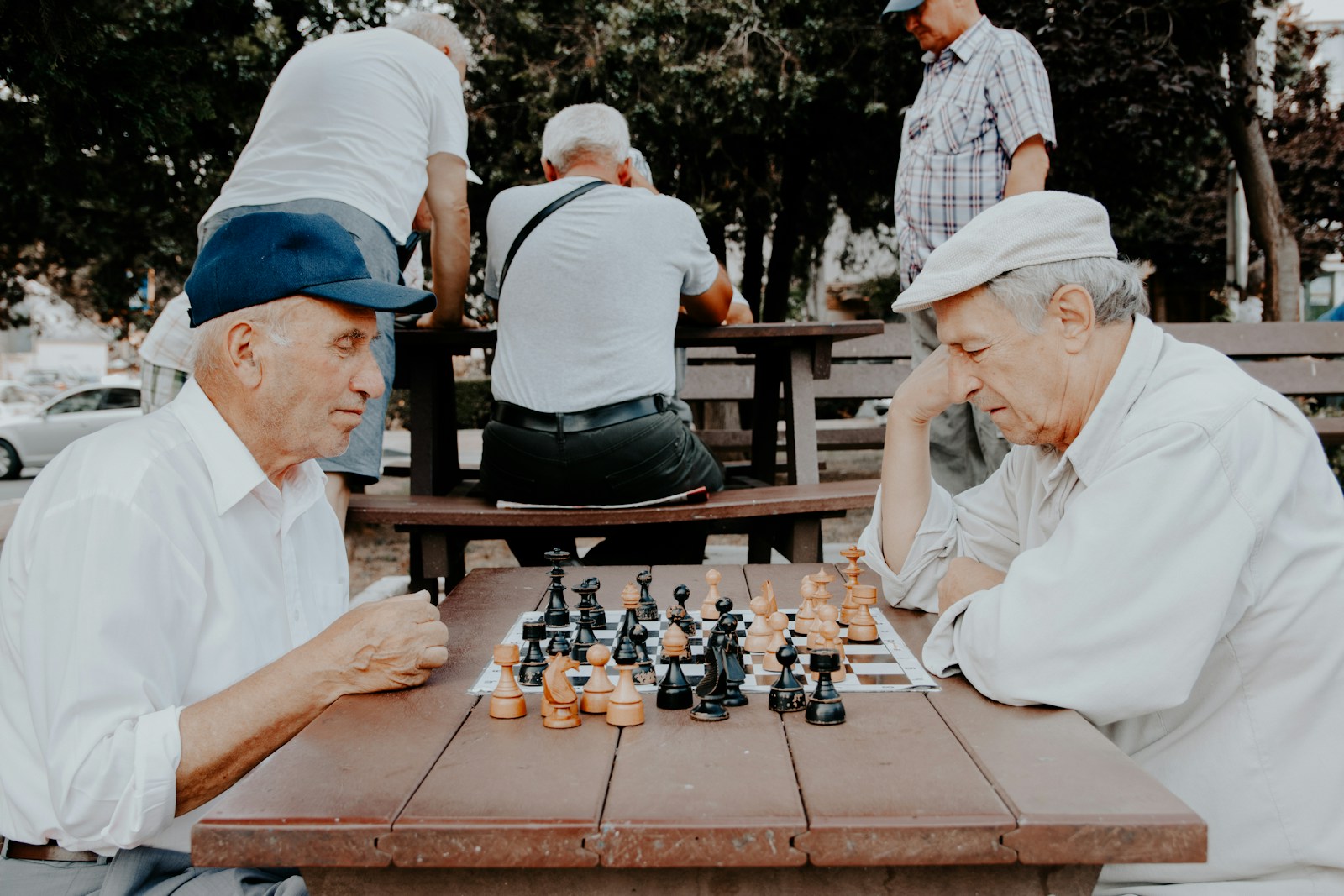 two men playing chess, life