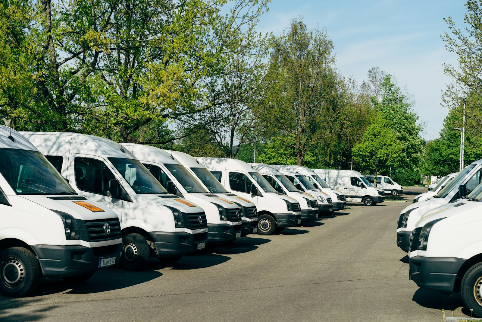 cars parked on parking lot during daytime, fleet